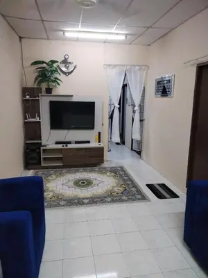 a living room with a flat screen tv on a wall at Ed 02 manjung in Seri Manjung