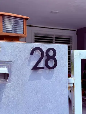 a house with the number on the side of it at 28 Harmoni Homestay, Kamunting in Kamunting