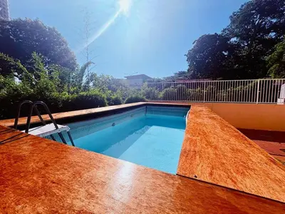 a swimming pool sitting on top of a wooden deck at Family Fun Private Pool Villa with KTV, BBQ, PS5, POOL TABLE, KITCHEN just 2-Minute Drive to Tanjung Bungah Beach in Tanjung Bungah