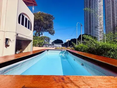 a swimming pool in the middle of a building at Family Fun Private Pool Villa with KTV, BBQ, PS5, POOL TABLE, KITCHEN just 2-Minute Drive to Tanjung Bungah Beach in Tanjung Bungah