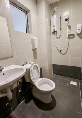 a bathroom with a toilet and a sink at DawnBlue Cameron Highlands in Brinchang