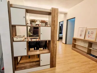 a room with a book shelf with a mirror at DawnBlue Cameron Highlands in Brinchang