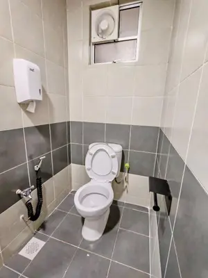 a bathroom with a toilet in a stall at DawnBlue Cameron Highlands in Brinchang