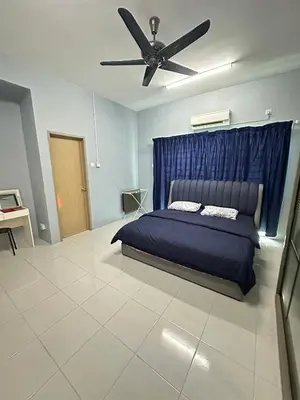 a bedroom with a bed and a ceiling fan at Nameera Stay Bandar Universiti Seri Iskandar in Seri Iskandar