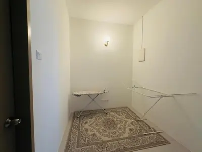 a walk in shower with a glass door and a rug at Nameera Stay Bandar Universiti Seri Iskandar in Seri Iskandar