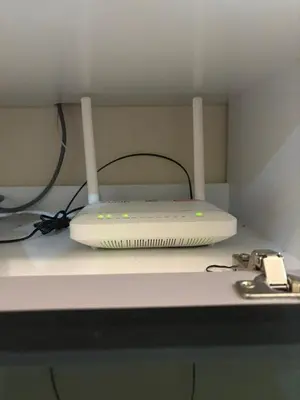 a laptop computer sitting on top of a desk at Nameera Stay Bandar Universiti Seri Iskandar in Seri Iskandar