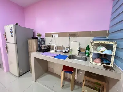 a small kitchen with a sink and a refrigerator at Sky Garden Ipoh Comfortable Homestay 6-7pax SY27 in Chemor