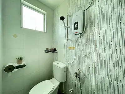 a bathroom with a shower and a toilet in it at Sky Garden Ipoh Comfortable Homestay 6-7pax SY27 in Chemor