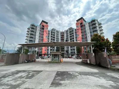 an empty parking lot in front of tall buildings at Sky Garden Ipoh Comfortable Homestay 6-7pax SY27 in Chemor