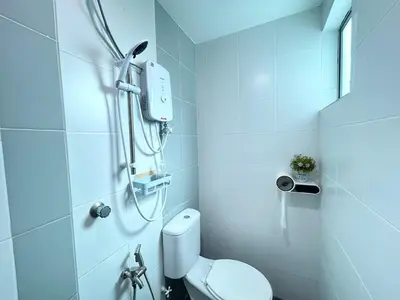 a bathroom with a shower with a toilet in it at Sky Garden Ipoh Comfortable Homestay 6-7pax SY27 in Chemor