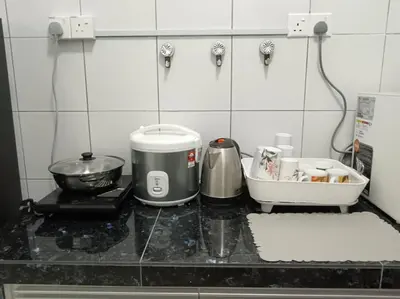 a kitchen with a counter with a mixer and a sink at FY Perumahan Makmur TR Jaya Tanah Rata in Tanah Rata