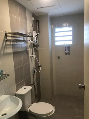 a bathroom with a toilet and a sink at DQis Nest Casa Apartment in Chemor