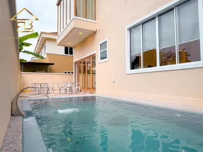 a swimming pool in front of a house at Aesthetic Muji Pool Villa in Ipoh 5BR 24Pax Karaoke Snooker Air hockey in Tambun