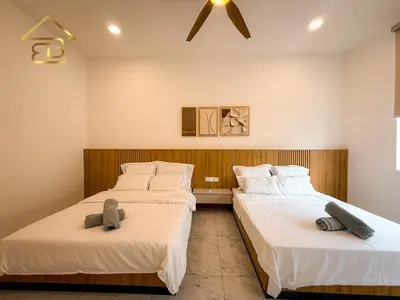 two beds sitting next to each other in a room at Aesthetic Muji Pool Villa in Ipoh 5BR 24Pax Karaoke Snooker Air hockey in Tambun