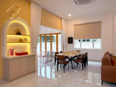 a kitchen and dining room with a table and chairs at Aesthetic Muji Pool Villa in Ipoh 5BR 24Pax Karaoke Snooker Air hockey in Tambun