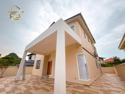 a house with a large white arrow on the front of it at Aesthetic Muji Pool Villa in Ipoh 5BR 24Pax Karaoke Snooker Air hockey in Tambun