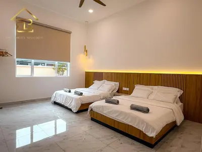 a bedroom with two beds and a large window at Aesthetic Muji Pool Villa in Ipoh 5BR 24Pax Karaoke Snooker Air hockey in Tambun