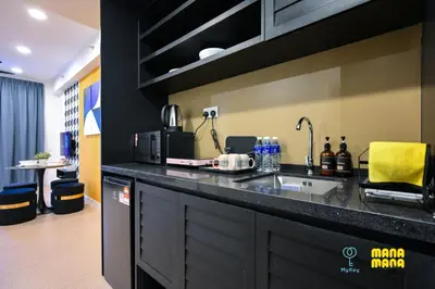 a kitchen with a sink and a counter top at Stallionz by MyKey in Ipoh