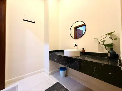 a bathroom with a sink and a mirror on a counter at myRoom at 11, Jalan Adams Georgetown in George Town