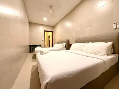 a bedroom with two beds with white sheets at myRoom at 11, Jalan Adams Georgetown in George Town