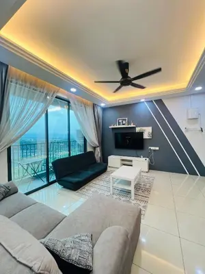 a living room with a couch and a ceiling fan at Erra Homestay Casa Meru Ipoh in Ipoh