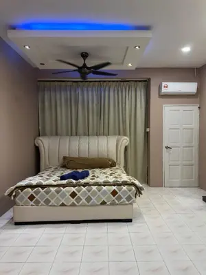 a bedroom with a bed with a blue ceiling at MM Homestay 80 in Kamunting
