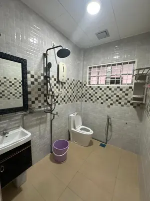 a bathroom with a shower and a toilet and a sink at MM Homestay 80 in Kamunting