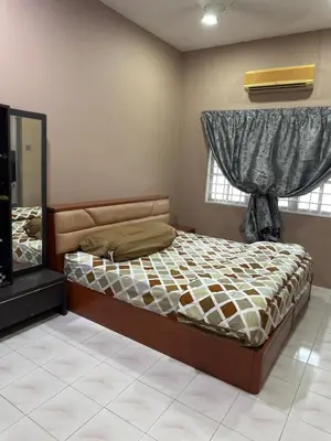 a bedroom with a bed and a window at MM Homestay 80 in Kamunting