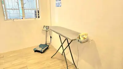 a table in a room with a phone on it at Burma Home at Jalan Burma Georgetown Penang in George Town