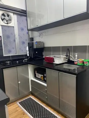 a kitchen with a sink and a counter top at Syahoney Homestay 2 with NETFLIX in Tanah Rata