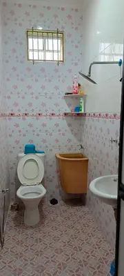 a bathroom with a toilet and a sink at A I HOMESTAY Balik Pulau in Balik Pulau