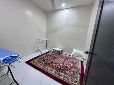 a room with a rug on the floor next to a door at Anjang Pat Kesang Laut Homestay in Gua Sai