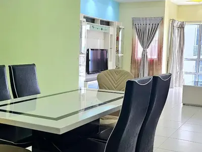 a dining room with a glass table and chairs at Sekinchan Family-style XL Size Homestay in Sekincan