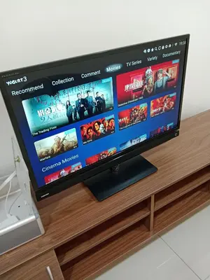 a flat screen tv sitting on top of a wooden entertainment center at Skyline Nest Crystal Creek in Taiping
