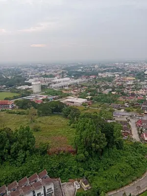an overhead view of a city with trees and buildings at Skyline Nest Crystal Creek in Taiping