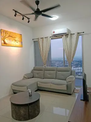 a living room with a couch and a ceiling fan at Skyline Nest Crystal Creek in Taiping
