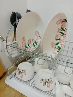 a shelf with plates and cups and a mirror at Skyline Nest Crystal Creek in Taiping