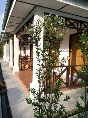 a building with a plant in front of it at D Tasek Homestay Lenggong