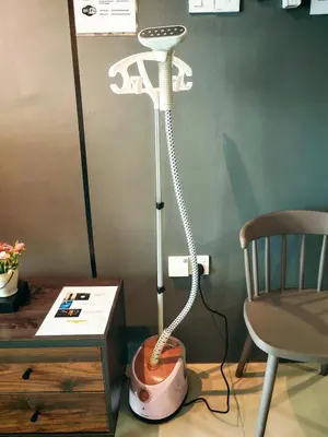 a white floor lamp in a room with a chair at Ipoh Manhattan Waterpark 3BR Suite by City Home Empire MHB509 in Ipoh