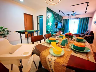 a living room with a table with a ping pongetitive at Ipoh Manhattan Waterpark 3BR 8Pax Suite by City Home Empire MHA304 in Ipoh