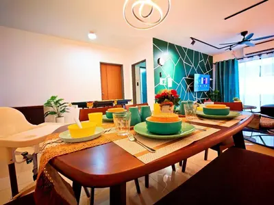 a dining room with a table with plates of food at Ipoh Manhattan Waterpark 3BR 8Pax Suite by City Home Empire MHA304 in Ipoh