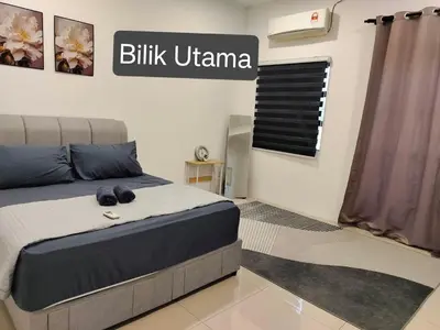 a bedroom with a bed and a sign that reads blitz ukraine at Dee Intan Homestay, Ipoh - Malay Only in Ipoh