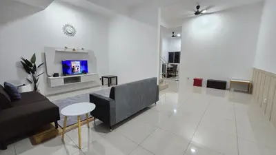 a living room with a couch and a tv at Dee Intan Homestay, Ipoh - Malay Only in Ipoh