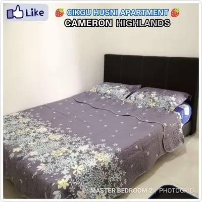 a bedroom with a bed in a room at Cikgu Husni Homestay Apartment Cameron Highlands in Tanah Rata