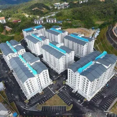 an overhead view of a group of white buildings at Cikgu Husni Homestay Apartment Cameron Highlands in Tanah Rata