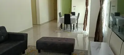 a living room with a table and a chair at Nausha Homestay Mus-lim ONLY in Kulim