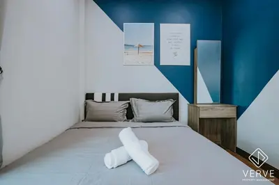 a bedroom with a bed with two pillows on it at Ipoh D Festivo 2B2B Suite by Verve EECH189 in Ipoh