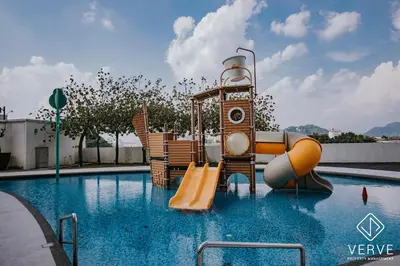 a swimming pool with a slide and a water park at Ipoh D Festivo 2B2B Suite by Verve EECH189 in Ipoh