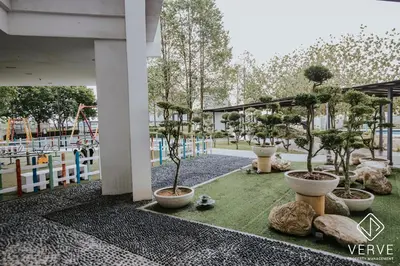 a group of potted trees in a park at Ipoh D Festivo 2B2B Suite by Verve EECH189 in Ipoh