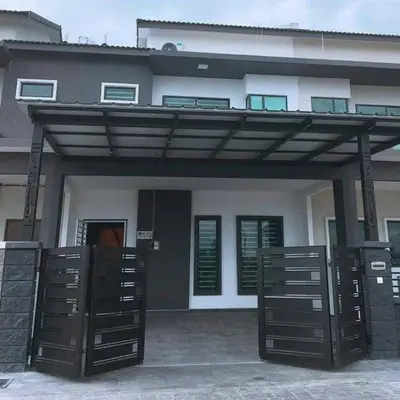 a building with awning in front of a house at Homestay sweet dream in Gua Sai